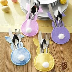 four forks and two spoons with bunny ears on them