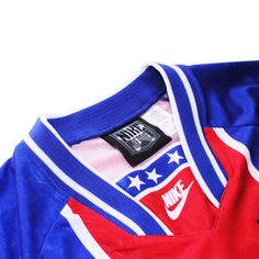 a red, white and blue nike jersey