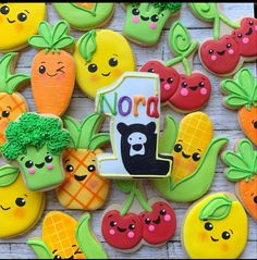 some decorated cookies are sitting on a table