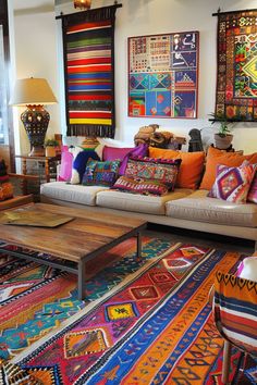 a living room filled with lots of furniture and colorful rugs on top of it