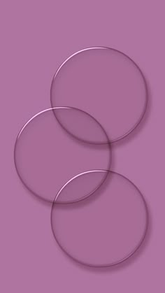 three circles on a purple background with the same color as they appear to be overlapping