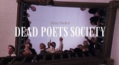 a group of people standing in front of a mirror with the words dead poets society on it