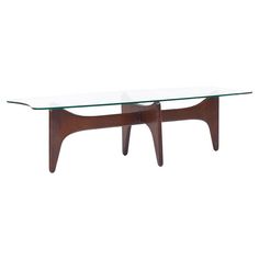 a glass and wood coffee table with two legs