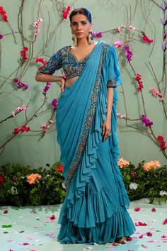 Blue pre-draped saree with zardozi embroidered border and ruffles. Comes with blouse and belt.
Components:3
Embroidery
Neckline:Sweetheart
Sleeve Length:Half
Fabric:Silk and Georgette
Color:Blue
Zardozi embroidered blouse
Back cutout with dori
Pleated saree
Closure: Hook back - Aza Fashions Pleated Saree, Blue Drapes, Drape Saree, Embroidered Saree, Desi Style, New Address, Blue Saree, Belt Design, Blouse For Women