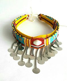 These are 100% handcrafted using fine beads, beading wire and chains. In this listing; You get 2 beaded maasai chokers(all adjustable) for USD.20 You can wear them as single necklaces or both of them. More neckleces here; https://www.etsy.com/shop/TribalTess?ref=seller-platform-mcnav&section_id=21306083 Back to my shop; https://www.etsy.com/shop/TribalTess?ref=seller-platform-mcnav Unique Adjustable Beaded Chain Choker, Handmade Adjustable Necklace For Festivals, Handmade Round Beads Choker For Festivals, Adjustable Bohemian Silver Beads, Bohemian Tiny Beads Jewelry For Fashion, Large Beads Festival Choker, Festival Large Beads Choker, Bohemian Beaded Chain Beads, Bohemian Beaded Chain