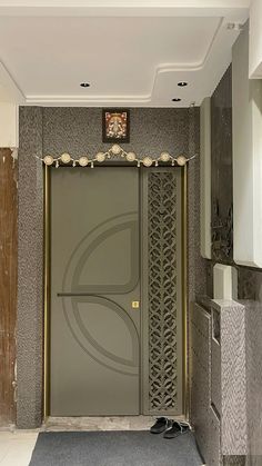 an entrance to a building with a clock on the wall above it and a carpeted floor