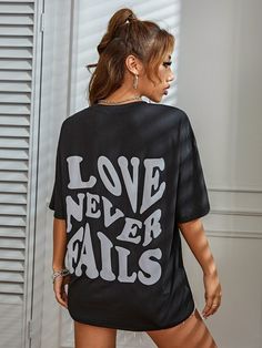 Feel empowered and inspired in our Love Never Fails: Summer Inspirational T-Shirt. Crafted from soft and breathable cotton fabric, this relaxed-fit tee is perfect for warm summer days. With an uplifting slogan "Love Never Fails" adorning the front, it serves as a beautiful reminder to always embrace love and optimism. Wear it to the beach, for outdoor activities, or just to relax with friends. Designed by Thekittenpark Motivational Slogans, Womens Tshirt, Love Never Fails, Graphic Top, Summer Cotton, Summer Days, Drop Shoulder, Fails, Cotton Fabric