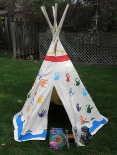 a teepee tent with hand prints on it