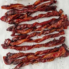 bacon strips sitting on top of a piece of paper