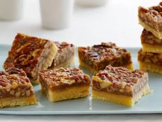 several pieces of pecan bars on a blue plate