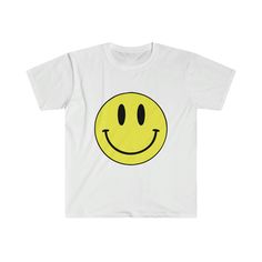 Vintage smiley face t shirt, Forrest Gump Happy Face T shirt. Shop our other Women's Apparel here: https://www.etsy.com/shop/SouthernNovelty?ref=seller-platform-mcnav&section_id=41566710 The unisex soft-style t-shirt puts a new spin on casual comfort. Made from very soft materials, this tee is 100% cotton for solid colors. Heather colors and sports grey include polyester. The shoulders have twill tape for improved durability. There are no side seams. The collar is made with ribbed knitting to prevent curling damage.  .: 100% ring-spun cotton (fiber content may vary for different colors) .: Light fabric (4.5 oz/yd² (153 g/m .: Eurofit .: Tear-away label .: Runs true to size White Graphic Tee With Smiley Face, Smiley Face T Shirt, White Smiley Face Graphic Tee, Funny White T-shirt With Smiley Face, Casual Smiley Face T-shirt, Cheap Fun Smiley Face T-shirt, Cheap Short Sleeve T-shirt With Smiley Face, Affordable Fun Smiley Face T-shirt, Cheap Funny T-shirt With Smiley Face