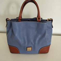 Dooney & Bourke Blue Brenna Pebbled & Vachetta Leather Satchel Barge Handbags Women's Designer Blue Satchel With Leather Handles, Light Blue Leather Bags With Gold-tone Hardware, Dooney Bourke Handbags, Dooney & Bourke Bags, Leather Satchel, Woman Colour, Dooney Bourke, Crossbody Bags, Satchel