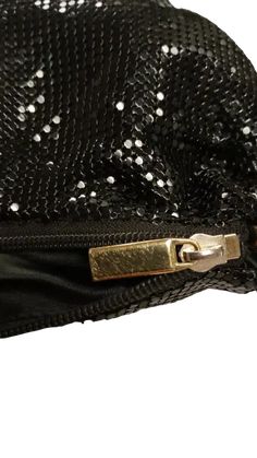 Evening Elegance Pre-Owned! Classic Black Mesh: Shimmering design for special occasions. Compact Size (9.5"L x 1"W x 6"D): Holds essentials for a night out. Detachable Chain Strap: Versatile for handheld or crossbody wear tarnished. Please Note: Pre-owned condition with minor wear scratched zipper pull, worn leather, touchy zipper. Intact Mesh & Liner: Main structure in good condition. Elegant Party Shoulder Bag With Zipper Closure, Elegant Party Bag With Zipper Closure, Black Evening Bags With Sequins, Black Sequined Bags For Formal Occasions, Formal Black Bag With Sequins, Glamorous Black Party Shoulder Bag, Formal Black Sequin Bag, Black Sequined Evening Clutch Bag, Black Sequin Evening Bag For Events