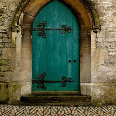 a green door with an arch above it