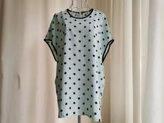 Vintage polka dots pattern summer top from the 1990's. Women's oversized summer top with a polka dot print in mint green and black. Has dolman sleeves and oversized boxy shape. Two small slits on the sides. Brand: Frankenwalder Material: 100% Polyester Size: Marked 38 DE, which is 8 US or M. Would fit even L. To be sure this item would fit you, please look at the measurements below. Approximate Measurements (taken when blouse lying flat, double armpit to armpit): Shoulder to Shoulder (from sleev Summer Polka Dot Crew Neck Top, Polka Dot Short Sleeve Blouse For Day Out, Polka Dot Blouse For Summer Day Out, Polka Dot Blouse For A Summer Day Out, Polka Dot Blouse For Day Out In Summer, Spring Polka Dot Tops With Relaxed Fit, Summer Short Sleeve Polka Dot Top, Oktoberfest Shirt, Festival Crop Tops