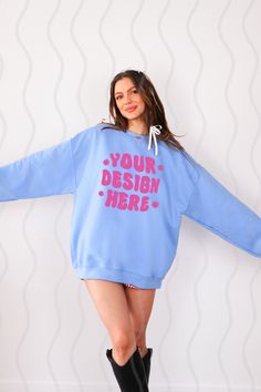 a woman wearing a blue sweatshirt dress with the words your design here printed on it