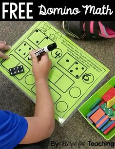 a young boy is playing with dominos in his playmat and it's free printable