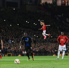 a soccer player is jumping in the air