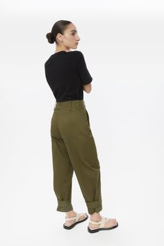 The Canvas Cotton Utility Tapered Pants - confidence with every step. An asymmetrical wavy fly puts a fashion-forward slant on these tapered cargo pants, crafted from canvas cotton twill. High-waisted - our tapered pants have been designed with a high rise, hook eye closure and the addition of belt loops and functional pockets. Spacious comfort - with a roomy leg shape and hidden snap button closure at the cuff, these utility pants are a daily staple. Pair the Canvas Cotton Utility Tapered Pants Tapered Cargo Pants, Jacket Fabric, Utility Pants, Tapered Pants, Hook Eye, Utility Jacket, Workout Pants, Snap Button, Trousers Women