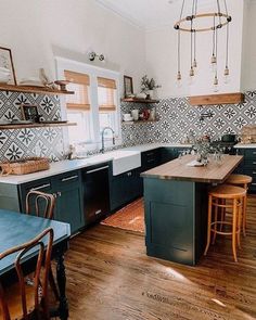 the kitchen is clean and ready to be used for cooking or baking, with wooden flooring