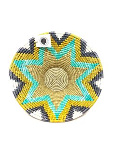 a round basket with blue, yellow and green designs on the bottom is shown in front of a white background