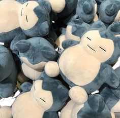 a pile of blue and white stuffed animals