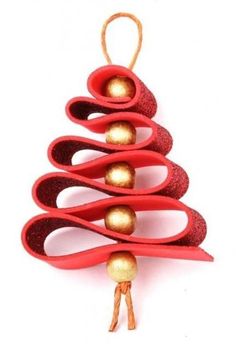 an ornament shaped like a christmas tree with gold balls hanging from it's sides