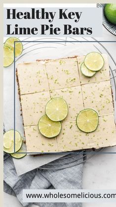 healthy key lime pie bars on a plate with limes around the edges and text overlay that says healthy key lime pie bars