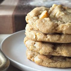 a stack of cookies sitting on top of a white plate