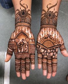 two hands with henna designs on them, one is showing the intricate design and the other has an elaborate pattern