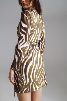 Elevate your fashion game with our Wrapped Long Sleeve Dress in the timeless Cream and Olive Green Zebra Print. This amazing dress boasts a never-out-of-style zebra print, making it the perfect versatile piece your closet has been longing for. Key Features: Midi length for a chic and sophisticated look. Embrace the allure of animal print with our captivating zebra pattern. Wide V-neck adds a touch of elegance. Long sleeves for both style and warmth. Bodycon fit that accentuates your curves. Idea Green Zebra Print, Tan Scarf, Green Zebra, Color Crema, Zebra Pattern, Long Sleeve Print Dress, Dress With Belt, Maternity Wear, Zebra Print