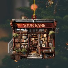 a christmas ornament hanging from the side of a tree with bookshelves