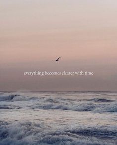 an ocean with waves and a bird flying in the sky above it that says, everything becomes closer with time