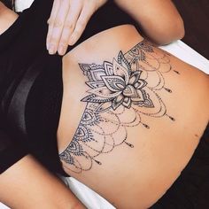 a woman with a tattoo on her stomach