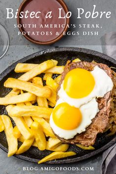 two eggs on top of steak and french fries in a skillet