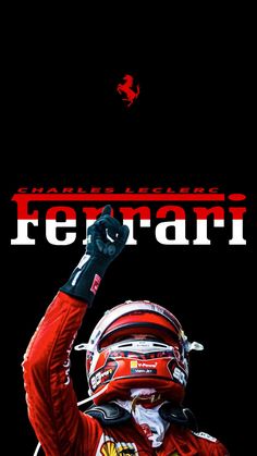 a man in a red racing suit holding his fist up with the words ferrari on it