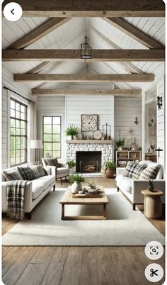 a living room filled with furniture and a fire place in the middle of a room