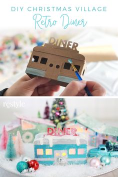 the diy christmas village is made out of cardboard and has been decorated with ornaments