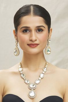 White rhodium and 14kt gold plated long necklace with big polki kundan stone embellishments. Comes with matching pair of earrings. - Aza Fashions Formal Kundan Jewelry With Gota Work, Elegant Necklace With Mirror Work For Party, Elegant Necklace With Mirror Work For Festive Occasion, Elegant Necklaces With Mirror Work For Celebrations, Festive Elegant Necklace With Mirror Work, Elegant Party Necklace With Mirror Work, Elegant Party Necklaces With Mirror Work, Elegant Kundan Necklace With Mirror Work For Diwali, White Kundan Fusion Necklace