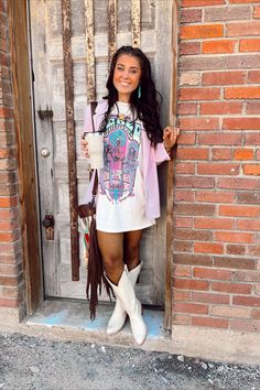 Grab your morning coffee with the girls in the lovely American Rodeo T-shirt. Designed with gorgeous printed fabric, the t-shirt features a round neckline, classic short sleeves, and a cute relaxed fit. Complement this gorgeous t-shirt with a pair of super comfy and stylish shorts. Features: Very comfortable Lightweight feel Breathable Printed front Short sleeves Round neckline Fits true to size Size up for a more dress like fit Plus Size Nashville Outfits, Jelly Roll Concert Outfit, Western Tshirt Dress, Dresses Concert, Nashville Style Outfits, Western Bags, Nashville Outfit, Tee Shirt Outfit, Stylish Shorts