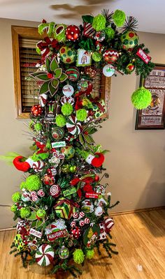 a christmas tree decorated with candy canes and candies