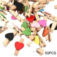 a pile of clothes pins with hearts on them