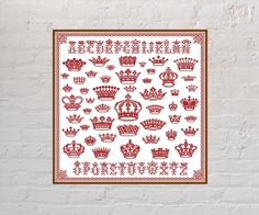 a cross stitch pattern with crowns on it