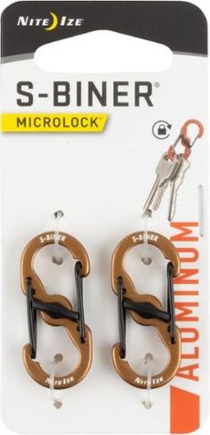 two pairs of scissors with keys attached to them