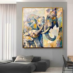 an elephant painting hanging on the wall in a living room