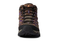 the women's waterproof hiking boot is shown in brown, purple and black