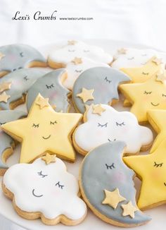 decorated cookies with stars and moon on a plate