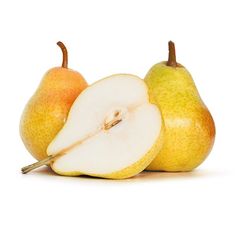 two pears, one cut in half and the other whole on a white background