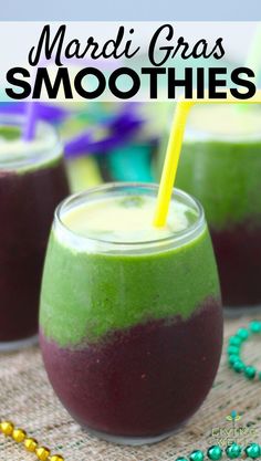 two glasses filled with green and purple smoothie on top of a table next to beads