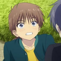 two anime characters are sitting in the grass and one has his mouth open while the other looks surprised